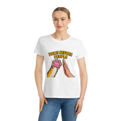 Person wearing a white t-shirt with 'Paws Before People' design on a white background