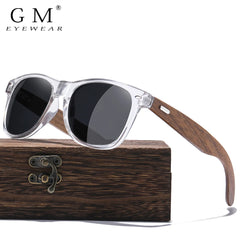 Sunglasses with wooden frame and case on a white background, featuring the brand 'GM Eyewear'.
