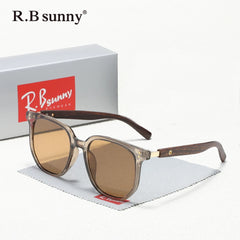 Sunglasses with brown lenses and wooden frame on a white background with R.B sunny branding.