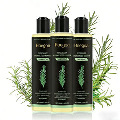 Three bottles of Hoegoa Rosemary Shampoo with rosemary leaves on a white background